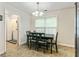 Bright dining area with a window and seating for four at 6561 Squire Pl, Douglasville, GA 30135