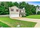 Attractive two-story home boasting an attached garage, and green lawn at 6561 Squire Pl, Douglasville, GA 30135