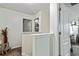 Upstairs hallway shows doors to other rooms with carpeted floors and white walls at 6561 Squire Pl, Douglasville, GA 30135