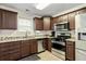 Modern kitchen with stainless steel appliances and granite countertops at 6561 Squire Pl, Douglasville, GA 30135