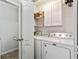 Laundry room with washer, dryer and storage cabinets at 6561 Squire Pl, Douglasville, GA 30135