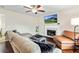 Cozy living room featuring a fireplace, comfortable seating, and hardwood floors at 6561 Squire Pl, Douglasville, GA 30135