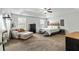 Spacious main bedroom with tray ceilings and a seating area at 6561 Squire Pl, Douglasville, GA 30135