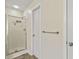 Walk-in shower features glass doors and multiple shower heads at 6561 Squire Pl, Douglasville, GA 30135