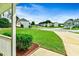 Pleasant street view showcasing the neighborhood's well-manicured lawns and various home styles at 6561 Squire Pl, Douglasville, GA 30135