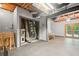 Basement with exposed ceiling, built-in bar area, mechanical closet, and a door leading to the outside at 3030 Winchester Dr, Cumming, GA 30041