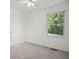 Bedroom with large window and carpet floors at 3030 Winchester Dr, Cumming, GA 30041