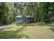 Charming home with lush greenery, and beautiful front lawn at 3030 Winchester Dr, Cumming, GA 30041
