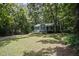 Charming home nestled amongst mature trees, offering a serene and private setting at 3030 Winchester Dr, Cumming, GA 30041