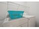 Functional laundry room with a washer and dryer, complemented by storage shelves and a laundry basket at 3030 Winchester Dr, Cumming, GA 30041
