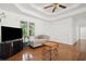 Bright living room with wood floors, neutral paint, ceiling fan, and lots of natural light at 3030 Winchester Dr, Cumming, GA 30041