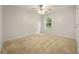 Bedroom featuring a large window and ceiling fan at 5156 Amberden Hall Dr, Suwanee, GA 30024