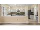 Modern kitchen with gray cabinets, granite counters, stainless appliances and center island at 5156 Amberden Hall Dr, Suwanee, GA 30024