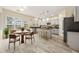 Spacious kitchen with granite counters, stainless appliances, and eat-in breakfast area at 5156 Amberden Hall Dr, Suwanee, GA 30024