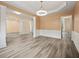 Spacious living room featuring wood floors and neutral decor with recessed lights at 5156 Amberden Hall Dr, Suwanee, GA 30024