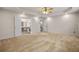 Large primary bedroom with a trey ceiling, fan and an ensuite bathroom at 5156 Amberden Hall Dr, Suwanee, GA 30024