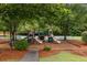 Community playground offers a safe and fun area for children to play and socialize at 5156 Amberden Hall Dr, Suwanee, GA 30024