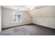 Comfortable carpeted bedroom with a window offering natural light and neutral paint on the walls at 6092 Giles Ct, Lithonia, GA 30058