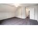 Inviting carpeted bedroom with a ceiling fan, window, and multiple doors for easy access at 6092 Giles Ct, Lithonia, GA 30058