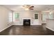 Spacious living area with a fireplace, hardwood floors, and backyard access at 6092 Giles Ct, Lithonia, GA 30058