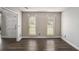 Bright living room with hardwood floors, neutral paint, and ample natural light at 6092 Giles Ct, Lithonia, GA 30058