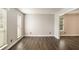 Bright living room with hardwood floors and neutral walls providing plenty of natural light at 6092 Giles Ct, Lithonia, GA 30058