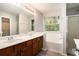 Updated main bathroom with a dual sink vanity, a separate shower, and a tub at 6092 Giles Ct, Lithonia, GA 30058