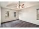 Spacious main bedroom with a tray ceiling and ample natural light from three windows at 6092 Giles Ct, Lithonia, GA 30058