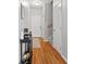 Entryway featuring wood floors, light gray walls, stairs, and decorative elements at 7268 Loblolly Ln, Morrow, GA 30260