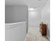 Bright hallway with neutral tones, a cozy carpet, and a stylish bookshelf at 7268 Loblolly Ln, Morrow, GA 30260