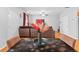 Open-concept living room featuring hardwood floors and comfortable leather sofa at 7268 Loblolly Ln, Morrow, GA 30260