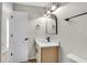 Bright bathroom featuring updated vanity and bronze fixtures at 8592 Hidden Creek Cir, Snellville, GA 30039