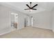 Bedroom view showcasing en-suite bathroom and a ceiling fan at 8592 Hidden Creek Cir, Snellville, GA 30039