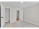 Carpeted bedroom with closet and open doorway at 8592 Hidden Creek Cir, Snellville, GA 30039