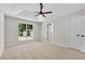 Bedroom with large window, trey ceiling and a ceiling fan at 8592 Hidden Creek Cir, Snellville, GA 30039