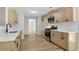 Modern kitchen featuring sleek countertops, stainless steel appliances, and stylish cabinetry at 8592 Hidden Creek Cir, Snellville, GA 30039