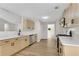 Well-equipped kitchen with stainless steel appliances, light wood cabinets, and white countertops at 8592 Hidden Creek Cir, Snellville, GA 30039
