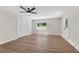 Open living room featuring a ceiling fan and wood floors at 8592 Hidden Creek Cir, Snellville, GA 30039