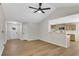 Spacious living room boasting hardwood floors, ample natural light, and an open layout to the kitchen at 8592 Hidden Creek Cir, Snellville, GA 30039