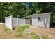 Outbuilding with a white privacy fence and access to the woods at 8592 Hidden Creek Cir, Snellville, GA 30039