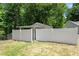View of outbuilding with white privacy fence at 8592 Hidden Creek Cir, Snellville, GA 30039