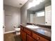 Bathroom featuring vanity with dark cabinets, dark countertop and a neutral paint at 122 Summer Pl, Norcross, GA 30071