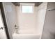 Bathroom featuring white shower-tub combo with white tile surround and a neutral paint at 122 Summer Pl, Norcross, GA 30071