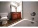 Bathroom featuring vanity with dark cabinets, dark countertop and a neutral paint at 122 Summer Pl, Norcross, GA 30071