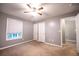 Spacious bedroom featuring neutral paint, ceiling fan and window offering plenty of natural light at 122 Summer Pl, Norcross, GA 30071