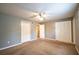 Large bedroom with carpet, neutral walls, and multiple closets, offering plenty of storage and a cozy feel at 122 Summer Pl, Norcross, GA 30071