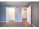 Bedroom featuring two open closet doors and blue-grey painted walls at 122 Summer Pl, Norcross, GA 30071