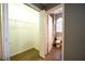 Walk-in closet leading to a bathroom with tile floors and a toilet at 122 Summer Pl, Norcross, GA 30071