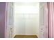 Large, open walk-in closet featuring wire shelving and neutral paint at 122 Summer Pl, Norcross, GA 30071