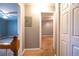 Hallway with carpet flooring and neutral-colored walls, which provides a transition between the rooms at 122 Summer Pl, Norcross, GA 30071
